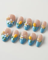 Lemon Grove press-on nails in medium oval shape — Blue French, 3D Lemon & Florals.