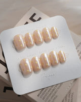 Lemon soda extra short coffin press-on nails with pearly nude base and milky white polka dots
