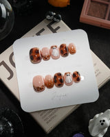 Leopard Boo handmade press-on nails in extra short squoval shape by Joyee Nails