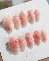 Lily-Nocturne press-on nails in extra short almond shape — Soft Peach Pink, 3D Lilies & Shell Textures.