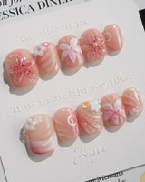 Lily-Nocturne press-on nails in extra short squoval shape — Soft Peach Pink, 3D Lilies & Shell Textures.