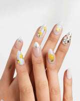 Limoncello glossy lemon nail art with candy-like yellow fruit details
