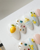 Limoncello Italian lemon press-on nails with tiny silver bows and ring charms
