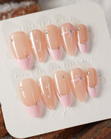 Love Gift press-on nails in medium almond shape — Soft Pink French, Bows & Polka Dots.