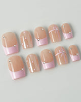 Love Gift press-on nails in short square shape — Soft Pink French, Bows & Polka Dots.