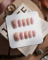 Love Letter press-on nails in short oval shape — Dreamy Shimmer Pink, 3D Metallic Bows, White Hearts & Hand-painted Ribbons.