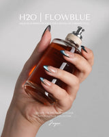 Malta Blue medium almond nails with midnight blue cat-eye French tips and gold outlines