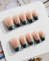 Malta Blue short coffin nails with deep blue shimmer tips and thin gold detailing