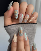 Mauritius Escape medium almond nails with glossy mint waves and 3D sea elements