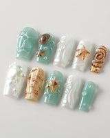Mauritius Escape medium square nails with pearly mint, shell accents, and 3D bubbles