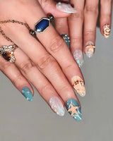 Mauritius Escape short almond nails with 3D shells, pearl drops, and ocean shimmer