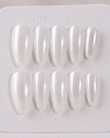 Clean Pearl press-on nails in medium almond shape — white chrome nails