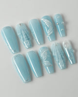 Mermaid Nail Designs Tale in long coffin shape with blue shell and wave accents