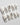 Metallic nail designs in white and silver tones for a chic look.