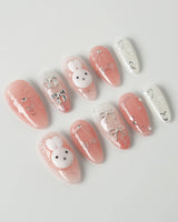 Miffy Sweetie press-on nails in medium almond shape — Sweet Pink-Orange, 3D Bunny & Silver Bows.