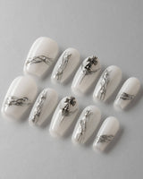 Minimalist metallic white nails for a clean and elegant look.