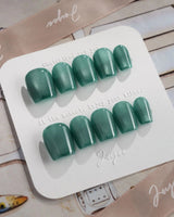 Mint Orb press-on nails in extra short coffin shape — Glacier Green Cat Eye
