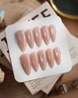 Moonstone press-on nails in medium stiletto shape — pearl lavender cat eye shimmer