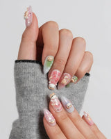 My Lulu medium short almond press-on nails with cat portrait feature nails