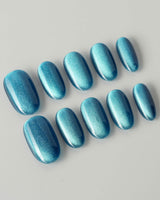 Blue Sky Cat-eye press-on nails in short oval shape — Peacock Blue cat eye
