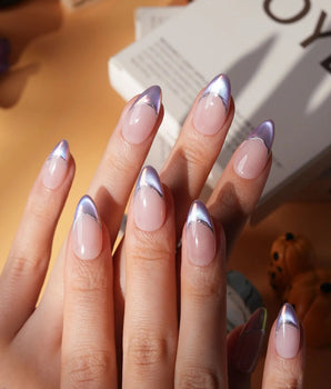 Nebula chrome French press on nails, nude base with a purple to blue to pink iridescent tip and a silver hand-drawn line - image 1