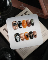 Nevermore handmade press-on nails in short oval shape by Joyee Nails