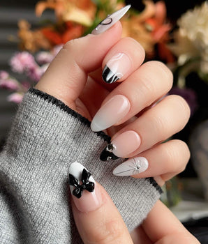 New Year Glam handmade press-on nails featuring Classic Black & White, 3D Bows & French Outlines.