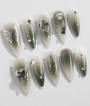 Night Butterfly nail art close-up showing black ombre chrome 3D gothic nails details