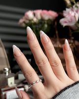 Dew Sparkle nails in short almond with silk-textured nude French tips and delicate pearls