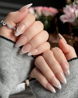 Dew Sparkle short almond press-ons with nude base, pearl accents, and glossy French tips