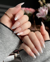 Your Glow press-on nails with nude cat-eye French tips and fine metallic gold linework