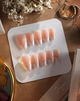 Your Glow in short stiletto shape with nude cat-eye French tips and glossy gel finish