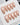 Salon-style nude press-ons with cat eye shimmer and gold edge