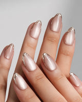 Nude Spark handmade press-on nails featuring Premium Champagne Cat Eye, Irregular French Metal Outlines.
