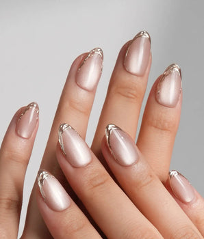 Nude Spark handmade press-on nails featuring Premium Champagne Cat Eye, Irregular French Metal Outlines.