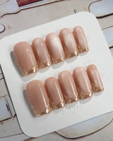 Nude Spark press-on nails in medium square shape — Premium Champagne Cat Eye, Irregular French Metal Outlines.