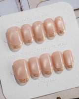 Nude Spark press-on nails in short oval shape — Premium Champagne Cat Eye, Irregular French Metal Outlines.