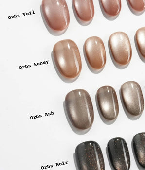 Orbs Team #1 handmade press-on nails featuring brown cat eye
