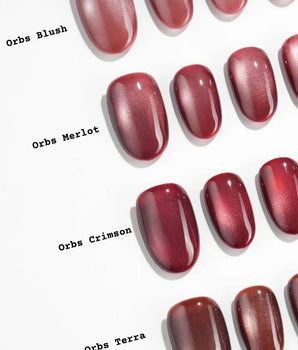 Orbs Team #2 handmade press-on nails featuring red cat eye