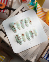 Otter Momo short almond nails with cuddly otter sculpture and soft water ripples