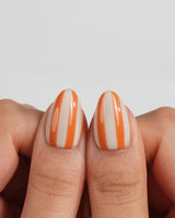 Parasol custom-size extra short almond nails with hand-painted parasol stripes