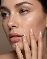 Petal Press handmade press-on nails featuring Warm Creamy Skin Tone, Hand-painted Florals & glitter Shimmer.