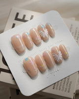 Petal Rain press-on nails — nude, 3D White Butterfly Wings & Pastel Wildflowers. handmade nail art by Joyee Nails