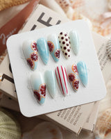 Pink Grapefruit citrus press-on nails in medium stiletto shape