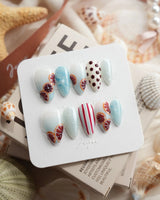 Pink Grapefruit citrus press-on nails in short almond shape