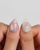 Pink Treasure hand-painted rose marble nails with iridescent shell confetti