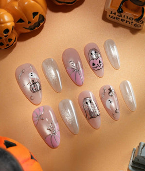 Pinkoween pink Halloween press on nails with pink pumpkins, a glitter ghost, silver bats and moons and holographic silver glitter nails - image 2