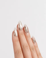 Plume nail art close-up showing Elegant Nude, Brushed Gold Foil Feathers & Fluid Textures. details