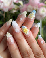 Plumeria-Island Breeze nail art close-up showing Dreamy Macarons, 3D Plumeria & Shell Textures. details