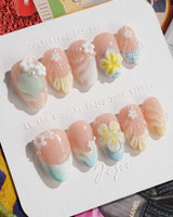 Plumeria-Island Breeze press-on nails in extra short almond shape — Dreamy Macarons, 3D Plumeria & Shell Textures.